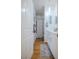 Bright bathroom with a single vanity, white cabinets, and beach themed decor at 1608 Rock Ridge Pl, North Las Vegas, NV 89084