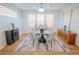 Bright dining room features modern lighting, stylish furnishings, and a sleek accent rug at 1608 Rock Ridge Pl, North Las Vegas, NV 89084