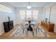 Bright dining room features modern lighting, stylish furnishings, and a sleek accent rug at 1608 Rock Ridge Pl, North Las Vegas, NV 89084