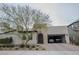 Charming single-story home featuring a brick driveway, arched doorway, and a convenient two-car garage at 1608 Rock Ridge Pl, North Las Vegas, NV 89084