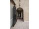 Elegant front entrance features an arched doorway and brick walkway, creating a welcoming approach at 1608 Rock Ridge Pl, North Las Vegas, NV 89084