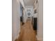Bright hallway with hardwood floors, leading to various rooms and featuring stylish décor at 1608 Rock Ridge Pl, North Las Vegas, NV 89084