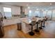 Modern kitchen featuring a large island with bar stools, granite countertops, and stainless steel appliances at 1608 Rock Ridge Pl, North Las Vegas, NV 89084