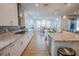 Modern kitchen with granite countertops, stainless steel appliances, and open layout at 1608 Rock Ridge Pl, North Las Vegas, NV 89084