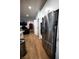 Modern kitchen with stainless steel refrigerator and appliances, open to the living area, offering seamless living space at 1608 Rock Ridge Pl, North Las Vegas, NV 89084
