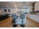 Open-concept kitchen with breakfast bar, stainless appliances, and pendant lighting at 1608 Rock Ridge Pl, North Las Vegas, NV 89084