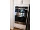 Stainless steel double ovens are built into white cabinets, providing a sleek and modern kitchen design at 1608 Rock Ridge Pl, North Las Vegas, NV 89084