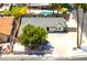 Aerial view of home with pool, mature trees, fenced yard, and large front parking area at 1700 Ivanhoe Way, Las Vegas, NV 89102