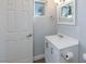 Bright bathroom with a white vanity, a window, and a clean, modern design at 1700 Ivanhoe Way, Las Vegas, NV 89102