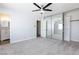 A spacious bedroom featuring a ceiling fan, large closets, and an ensuite bathroom at 1700 Ivanhoe Way, Las Vegas, NV 89102