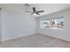 The spacious bedroom features a ceiling fan and large windows providing natural light at 1700 Ivanhoe Way, Las Vegas, NV 89102