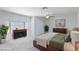 This spacious bedroom features neutral carpeting, a ceiling fan, and is bathed in natural light from the bay window at 1700 Ivanhoe Way, Las Vegas, NV 89102
