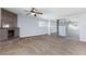 Spacious bedroom with ceiling fan, mirrored closet doors, and stone fireplace feature at 1700 Ivanhoe Way, Las Vegas, NV 89102