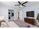 Comfortable bedroom with neutral tones, a ceiling fan, and built-in closet storage offers a serene retreat at 1700 Ivanhoe Way, Las Vegas, NV 89102