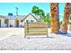 Charming home featuring desert landscaping, palm trees, and a wooden address marker out front at 1700 Ivanhoe Way, Las Vegas, NV 89102