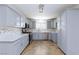 This well-appointed kitchen boasts modern cabinets, stainless steel appliances, and a stylish mosaic backsplash at 1700 Ivanhoe Way, Las Vegas, NV 89102