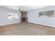 Living room featuring carpet, fireplace, and two windows offering natural light at 1700 Ivanhoe Way, Las Vegas, NV 89102