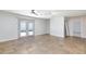 A sprawling living room with a patio entrance floods the space with natural light and offers seamless outdoor access at 1700 Ivanhoe Way, Las Vegas, NV 89102
