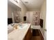 Neutral bathroom features a tub-shower, framed mirror and sink with wood cabinets at 2072 Mesquite Ln # 102, Laughlin, NV 89029