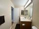 Bright bathroom featuring neutral walls, a wood vanity, and ceramic tile floor at 2072 Mesquite Ln # 102, Laughlin, NV 89029