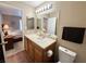 Bathroom showcasing a wood vanity and hardwood-style flooring at 2072 Mesquite Ln # 102, Laughlin, NV 89029