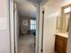 Open doorway revealing a cozy carpeted bedroom with neutral paint and comfortable furniture at 2072 Mesquite Ln # 102, Laughlin, NV 89029