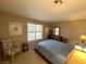 Carpeted bedroom features a queen bed, window with blind, and neutral-colored walls at 2072 Mesquite Ln # 102, Laughlin, NV 89029