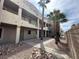 Exterior view of condo with multiple units and desert landscaping at 2072 Mesquite Ln # 102, Laughlin, NV 89029