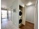 Hallway with stacked laundry and bright entry door at 2072 Mesquite Ln # 102, Laughlin, NV 89029