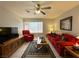 Cozy living room offers natural light with comfortable seating, and a ceiling fan for added comfort at 2072 Mesquite Ln # 102, Laughlin, NV 89029
