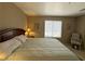 Relaxing main bedroom features comfortable furnishings with natural light from the window at 2072 Mesquite Ln # 102, Laughlin, NV 89029