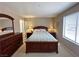 A fully furnished main bedroom has ample space and natural light from the window at 2072 Mesquite Ln # 102, Laughlin, NV 89029