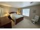 A serene main bedroom features a spacious bed and soft natural light at 2072 Mesquite Ln # 102, Laughlin, NV 89029