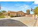 Expansive backyard with a paved area and basketball hoop, perfect for outdoor activities and entertainment at 215 Great Gable Dr, Las Vegas, NV 89183