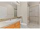 A bathroom features a standing shower, a single sink and mirror at 215 Great Gable Dr, Las Vegas, NV 89183