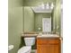 Cozy half-bathroom featuring tile accents, a well-lit mirror, and a classic vanity at 215 Great Gable Dr, Las Vegas, NV 89183
