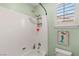 Bright bath includes a shower with mermaid art and colorful tile at 215 Great Gable Dr, Las Vegas, NV 89183
