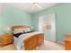 Brightly lit bedroom with neutral walls, carpet, and a ceiling fan at 215 Great Gable Dr, Las Vegas, NV 89183