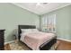 The main bedroom offers wood-look flooring and shuttered windows at 215 Great Gable Dr, Las Vegas, NV 89183