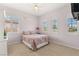 Cozy bedroom with shuttered windows, a floral-print quilt, and pale pink walls at 215 Great Gable Dr, Las Vegas, NV 89183