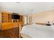 Comfortable bedroom featuring built-in shelves, a ceiling fan, and hardwood floors at 215 Great Gable Dr, Las Vegas, NV 89183