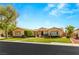 Charming single-story home featuring a well-manicured lawn, desert landscaping and beautiful architecture at 215 Great Gable Dr, Las Vegas, NV 89183