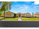 Charming single-story home featuring a well-manicured lawn, desert landscaping and beautiful architecture at 215 Great Gable Dr, Las Vegas, NV 89183