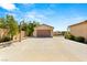 Spacious detached garage with ample driveway space for multiple vehicles and a basketball hoop at 215 Great Gable Dr, Las Vegas, NV 89183