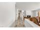 Elegant hallway with tile flooring, leading to a living room with fireplace and built-in shelving at 215 Great Gable Dr, Las Vegas, NV 89183