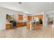 Bright kitchen features a workstation, an island bar with seating, and modern stainless steel appliances at 215 Great Gable Dr, Las Vegas, NV 89183