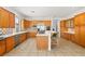 Spacious kitchen showcases marble countertops, stainless steel appliances, and a central island bar with seating at 215 Great Gable Dr, Las Vegas, NV 89183