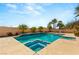 Backyard pool with spa featuring a geometric tile design and mature landscaping at 215 Great Gable Dr, Las Vegas, NV 89183