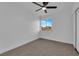 A bright room with neutral carpet and a window lets in natural light at 241 E Van Wagenen St, Henderson, NV 89015