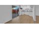 Open-concept kitchen and dining area with modern cabinets and a sliding door to the back patio at 241 E Van Wagenen St, Henderson, NV 89015